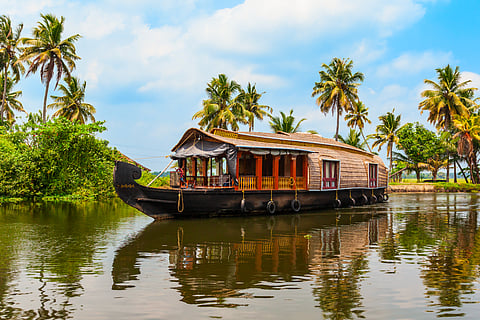 A houseboat sailing in Alappuzha backwaters in Kerala