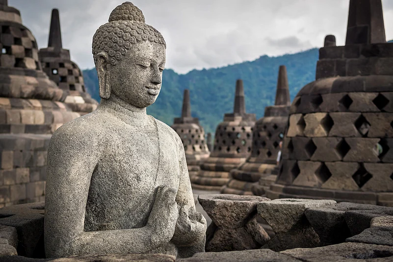 Ancient Buddha statue at Borobudur temple in Yogyakarta, Java, Indonesia