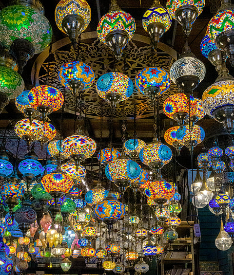 Colourful lanterns and statues in antique shops at Chatuchak Weekend Market, Bangkok