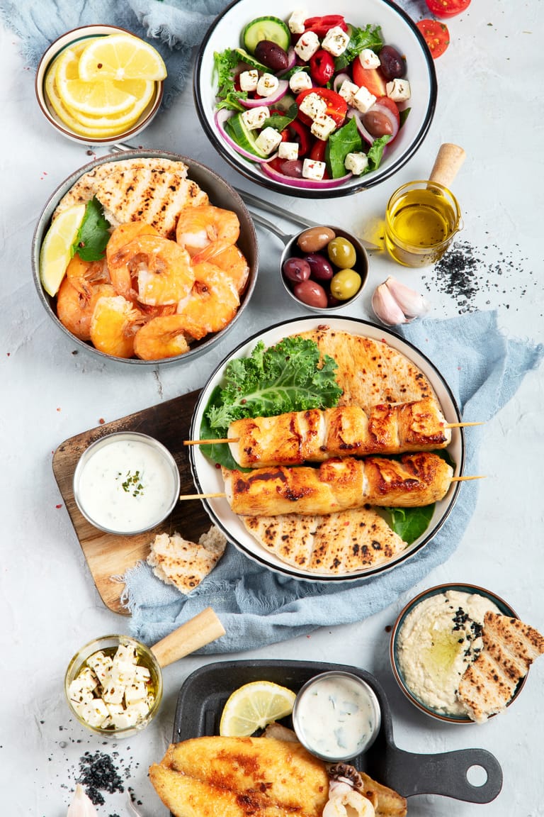 An assortment of traditional Greek dishes - Shutterstock