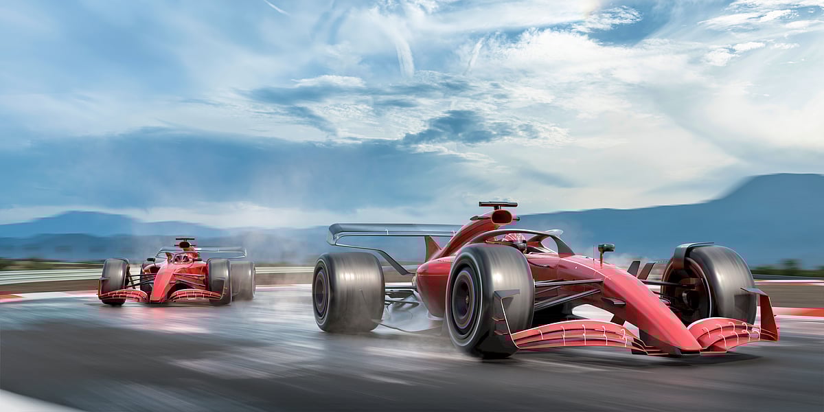 Two red supercars in a race