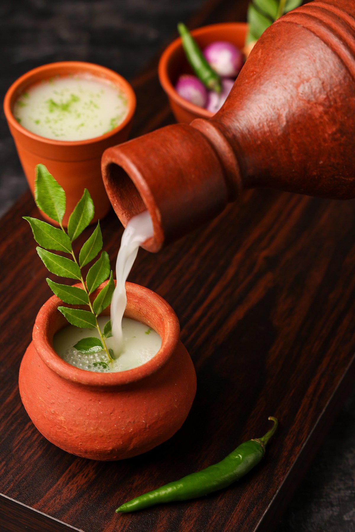 Shutterstock : Spiced buttermilk, or Chaas, being poured