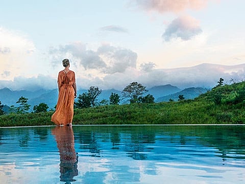 A woman stands within the premises of Santani Wellness, Kandy, Sri Lanka