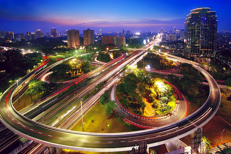 Aerial view of a beautiful Semanggi interchange overpass in the nighttime in Jakarta, Indonesia