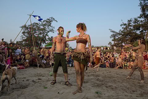 Performers dancing inside the drum circle in Arambol