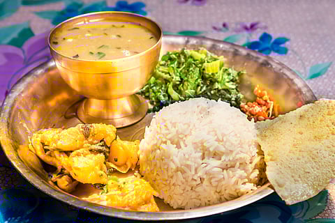 Dal Bhat, traditional Nepali meal platter with rice, lentils soup, vegetables and papad
