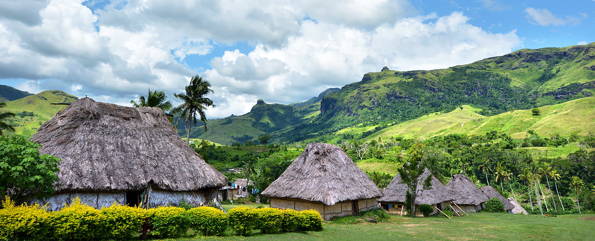 Panoramic landscape view of Fijian bures in Navala village