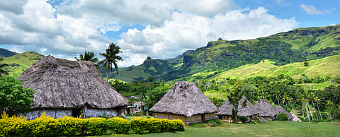 Panoramic landscape view of Fijian bures in Navala village