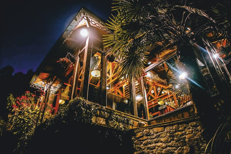Glass
conservatory lit up
on a starry night