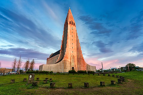 Beautiful sunset sky shining on Hallgrimskirkja Lutheran Church