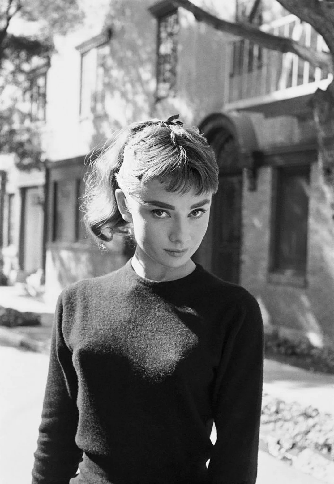 A portrait of Audrey Hepburn in black and white