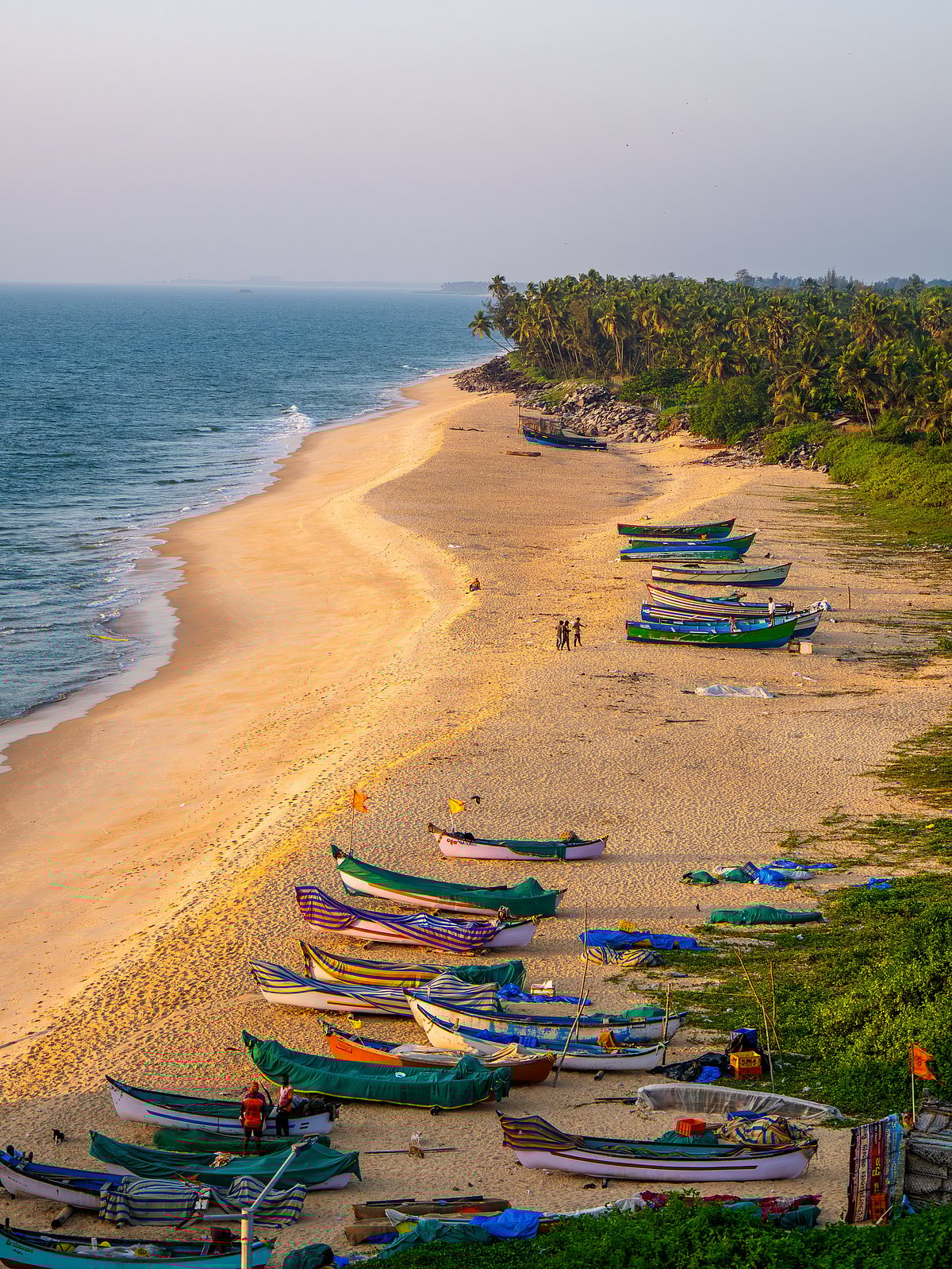 Aerial view of traditional fishing boats at Kapu Beach in Karnataka