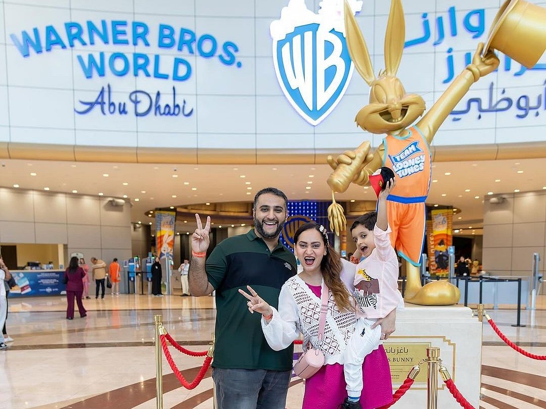 The trio pose for a photo in Abu Dhabi