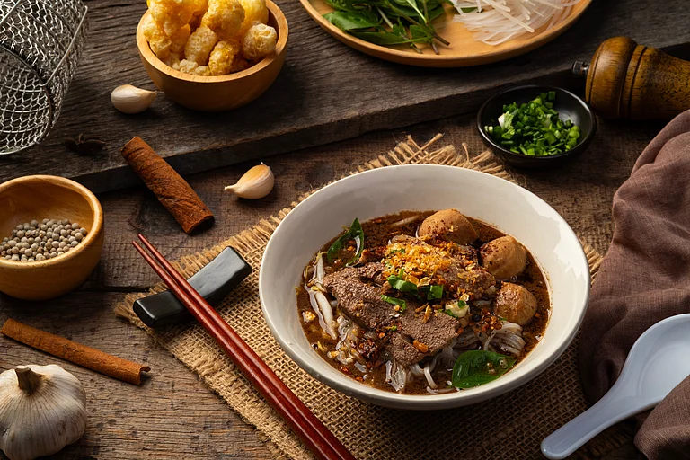 Traditional boat noodles soup is made of dark soy sauce and cow's blood - Shutterstock.com