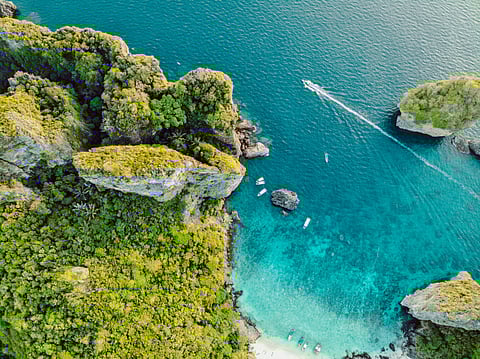 An aerial view of the blue waters of Phi Phi Islands