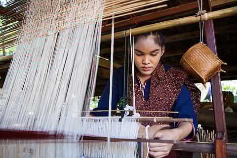 Learn the art of weaving Thai silk at Jim Thompson  House