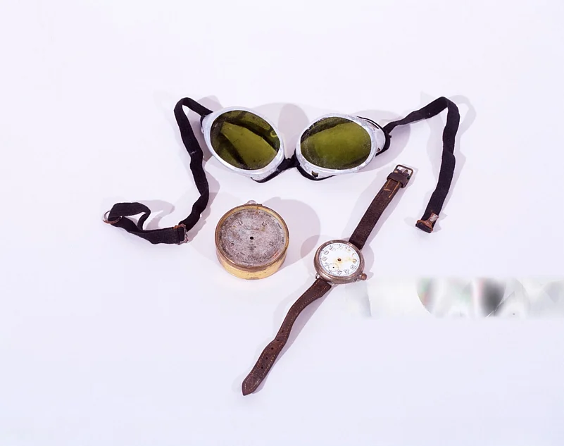 Mallorys essentials: goggles, altimeter, and wristwatch adorned with a leather strap
