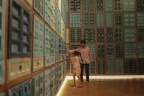 This exhibit with multiple doors and windows showcases a few of the stories from the recent history of Gujarat