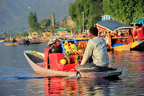 A man on his way to the floating market of Dal Lake