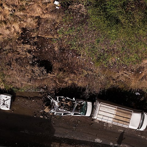 A damaged vehicle on Churath Nala Road in Shimla