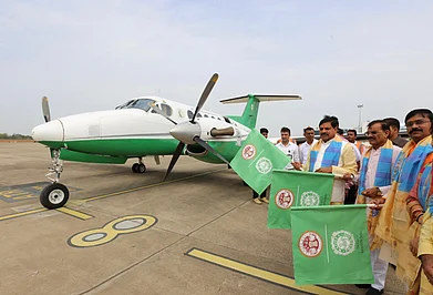 Copyright: Madhya Pradesh Tourism Board : Chief Minister Dr Mohan Yadav (wearing a blue scarf on the leftmost side) flagged off the first flight under the PM Shri Paryatan Vayu Seva at Bhopal Airport