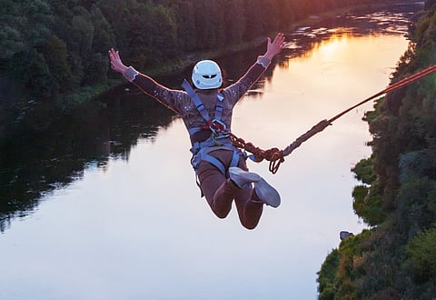 Adventurers plunge 40m from a platform mounted above the Kundalika River