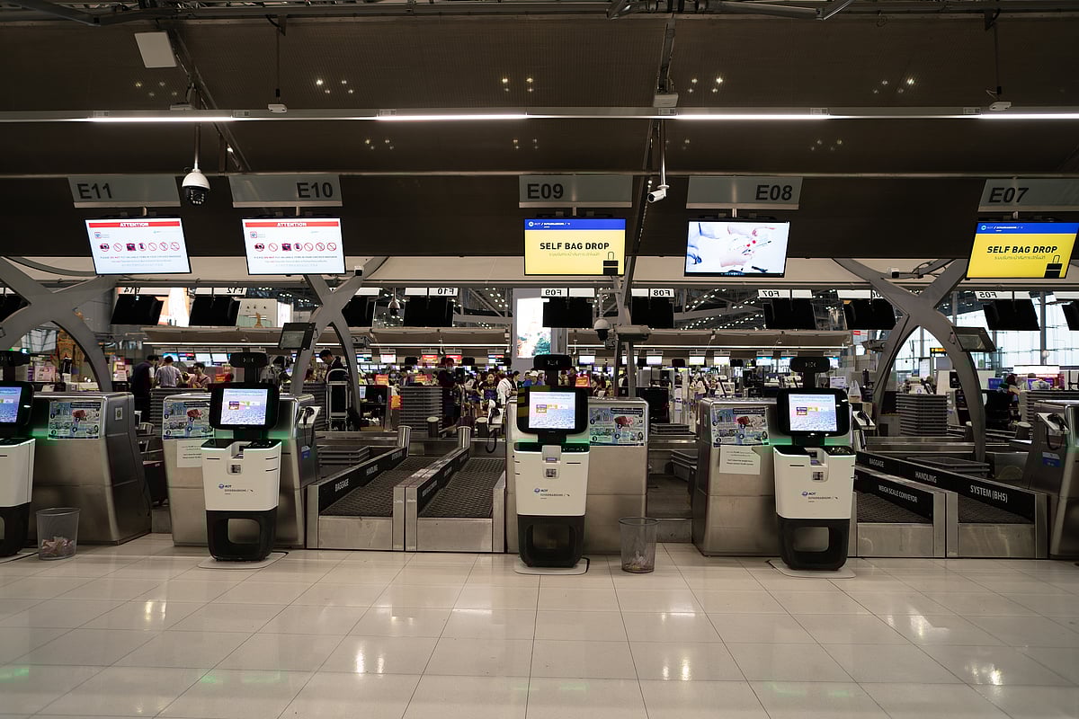 Conventional self-service baggage drop-off units enable travellers to bypass check-in desks. Pictured here is Suvarnabhumi Airport 