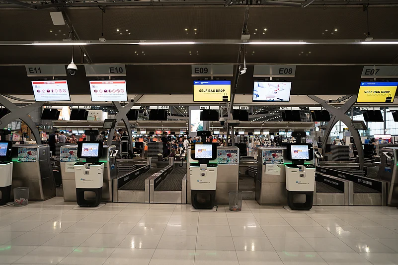 Conventional self-service baggage drop-off units enable travellers to bypass check-in desks. Pictured here is Suvarnabhumi Airport