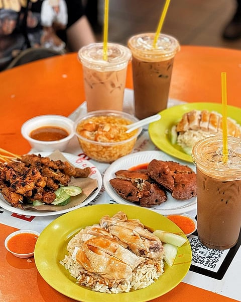 Maxwell Food Centre in Chinatown is bustling food court, without a Michelin-starred Hainanese chicken rice stall