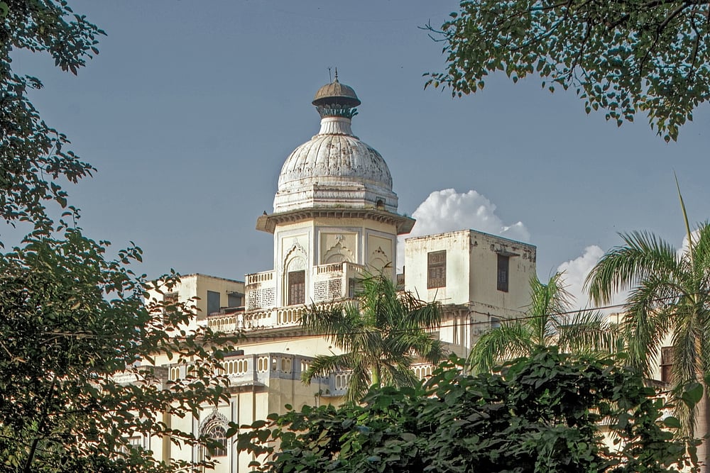 AnilD/Shutterstock : Chattar Manzil is also known as the  Umbrella Palace 