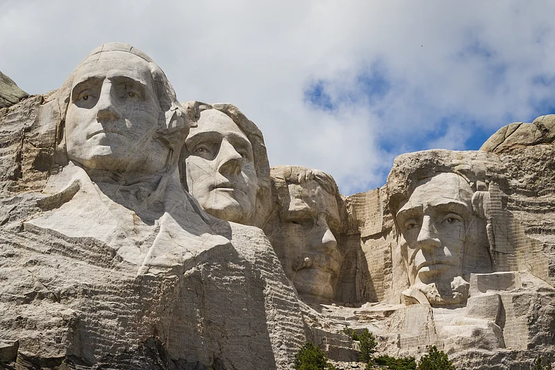 The Mount Rushmore National Memorial is a colossal sculpture carved into the granite face of Mount Rushmore in the Black Hills near Keystone, South Dakota