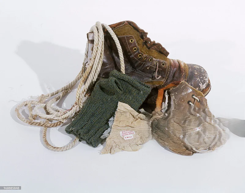 George Mallorys belongings: hobnail boot, fragments of a second boot and climbing rope, single fingerless glove, and cloth fragment with labels