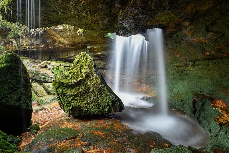 Cave exploration also leads to discovering natural marvels like hidden waterfalls
