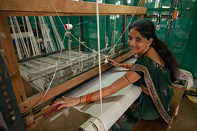 PradeepGaurs/Shutterstock.com : A weaver on her handloom creating a Maheshwari saree