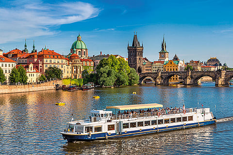 Charles Bridge connects the banks of the Vltava river