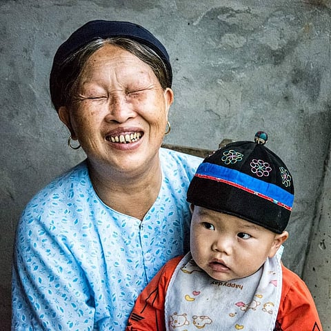 A Nùng woman and child