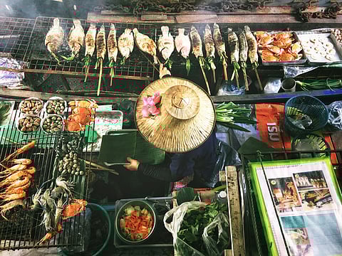 A look a food being prepared at a market in Thailand