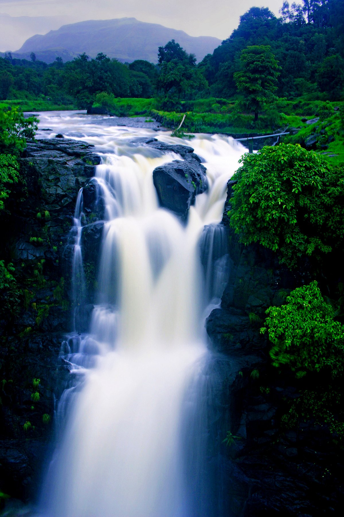 Upon reaching the top, soak in the villages natural beauty while enjoying the falls