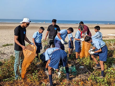 A Morjim Beach clean-up drive with children