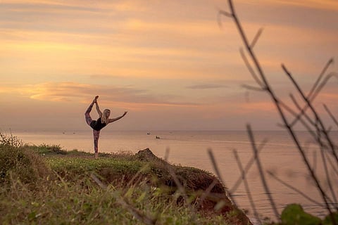 Yoga at sunset in Varkala