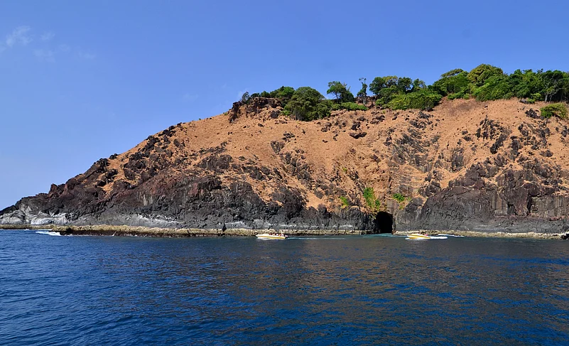 Netrani rose up like a single humpback whale in the middle of a surging sea