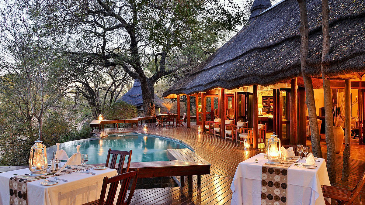 Luxurious chalets and outdoor tables at Imbali