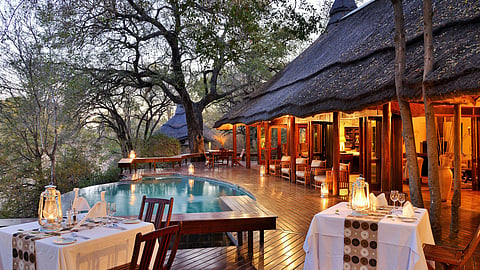 Luxurious chalets and outdoor tables at Imbali