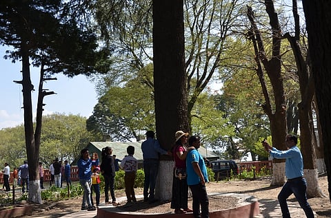 Tourists around the historic Christ Church in Kasauli