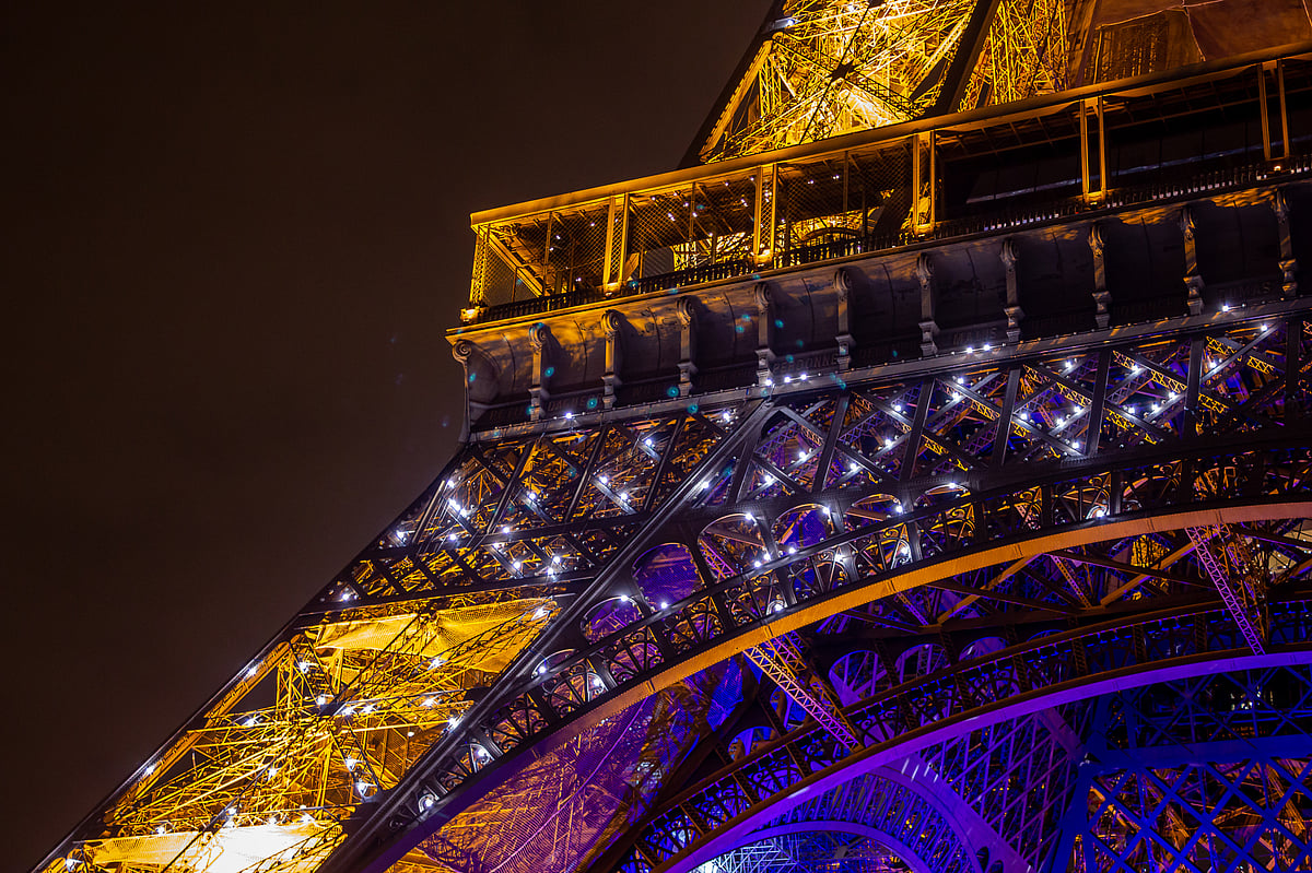 The Eiffel Tower sparkling at night during the hourly light show
