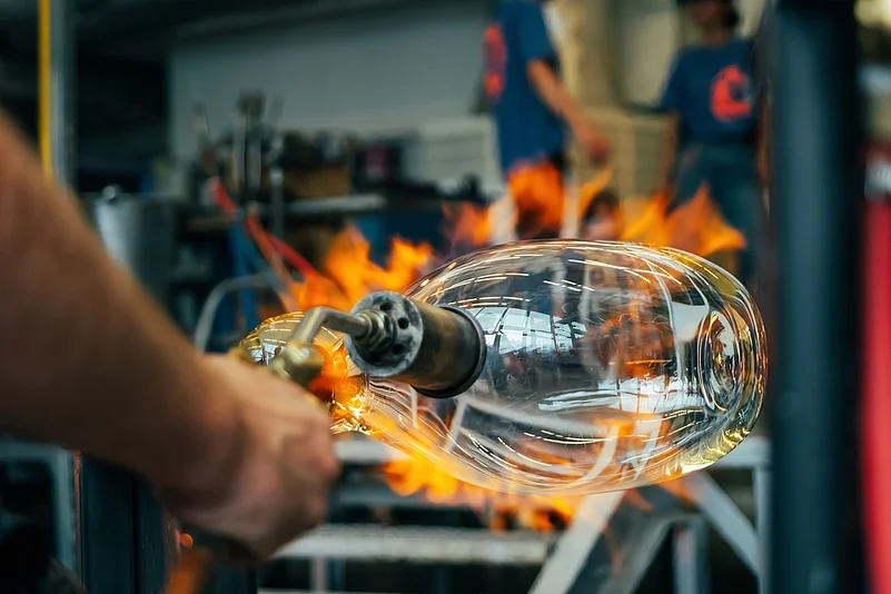Shaping hot molten glass takes hours
