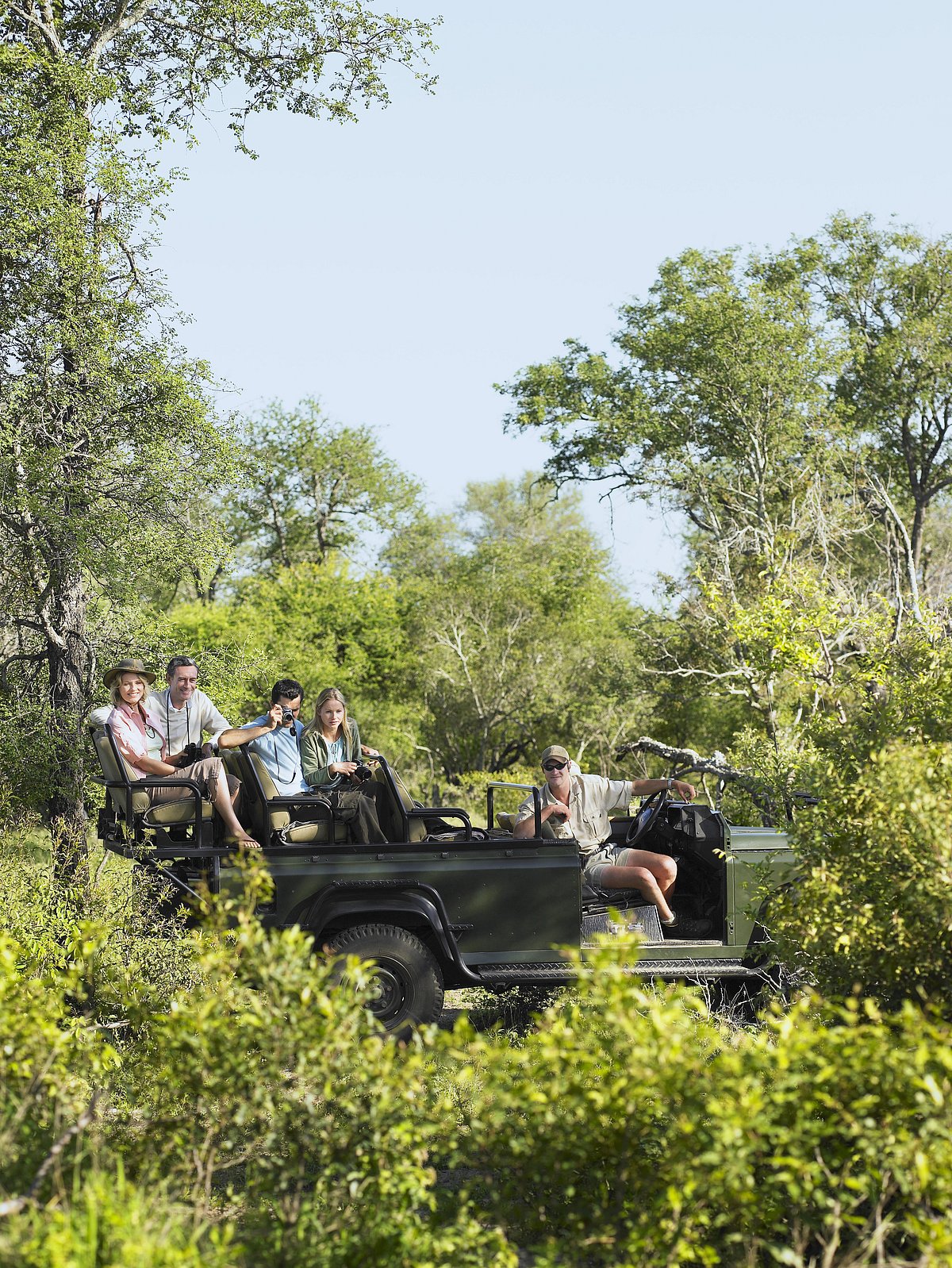 Shutterstock : A group of people on a jungle safari