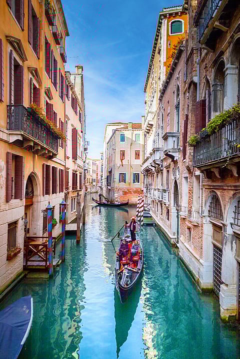 Tourists at Venice canal, Italy