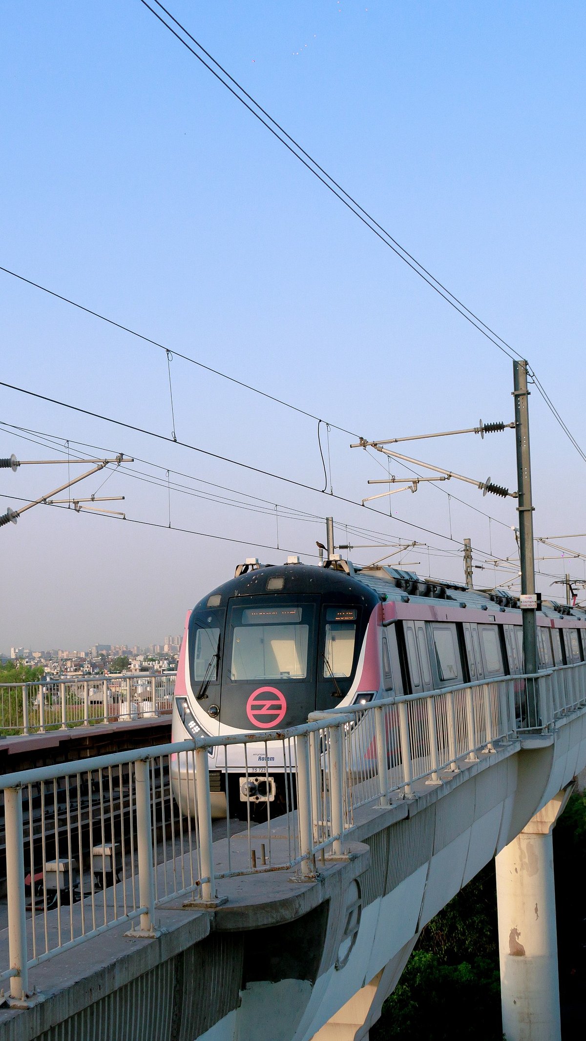 Shutterstock : A Delhi metro rides on its route