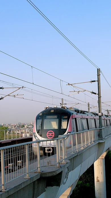 Shutterstock : A Delhi metro rides on its route